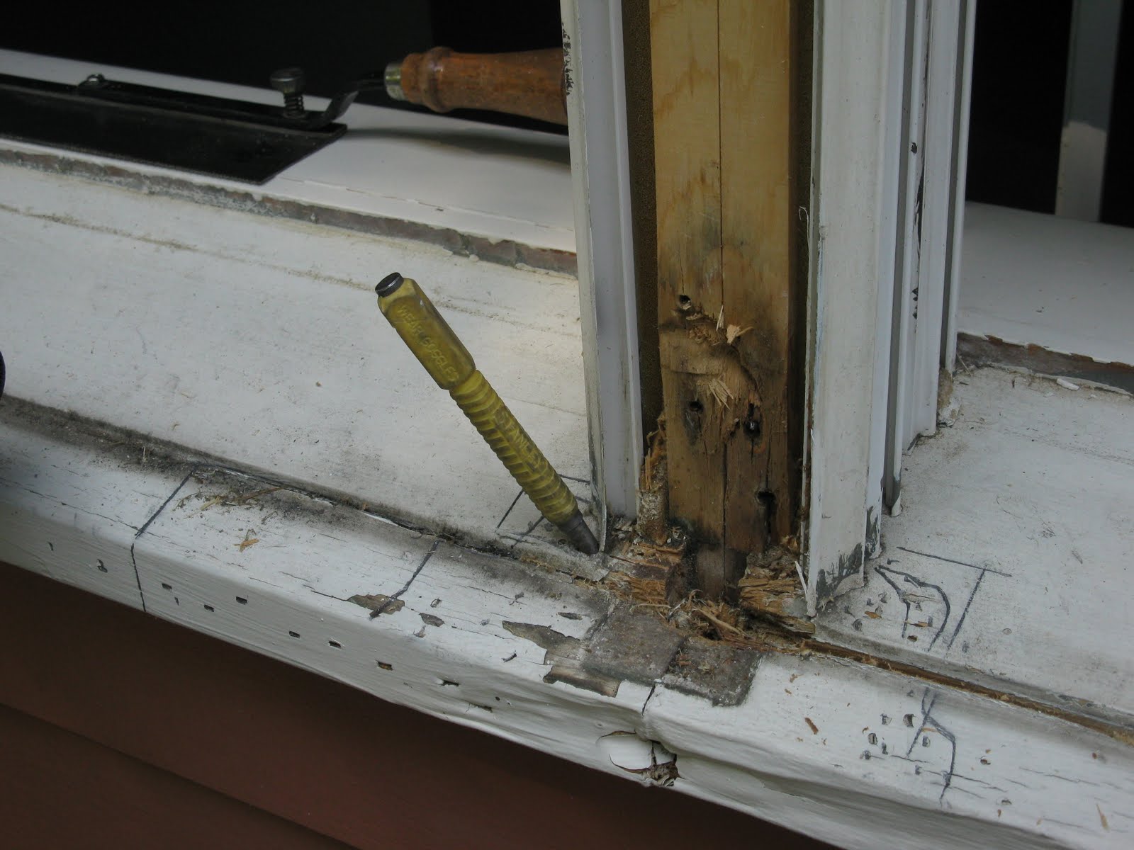 Repairing A Window Sill - Concord Carpenter A Carpenter Cut The Top Section Of A Window Frame